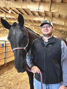 James George and equine friend